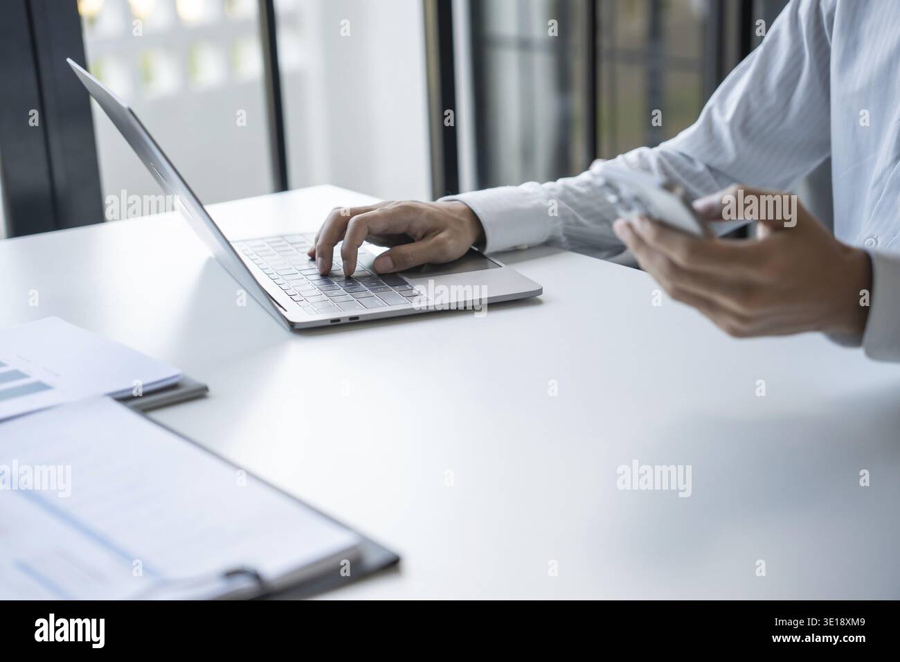 Successful Businessman Using Smartphone During Office Work Stock Photo