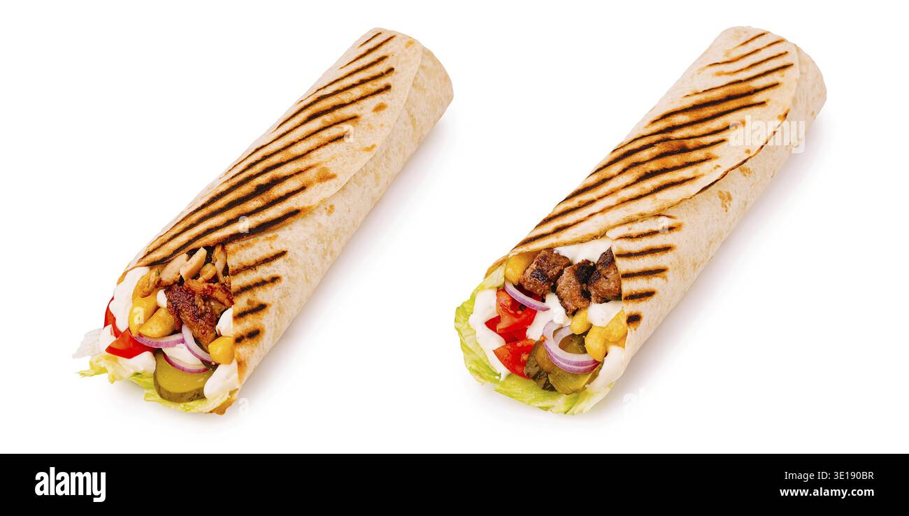 Enjoying flavorful wraps filled with juicy grilled meat, vibrant vegetables, and tangy sauces at an outdoor picnic under the warm sun. Perfect for a c Stock Photo