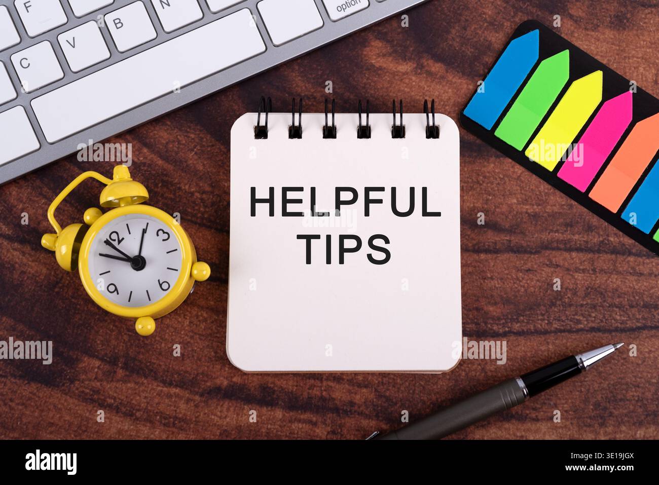 High angle view of Helpful tips text on notepad Stock Photo