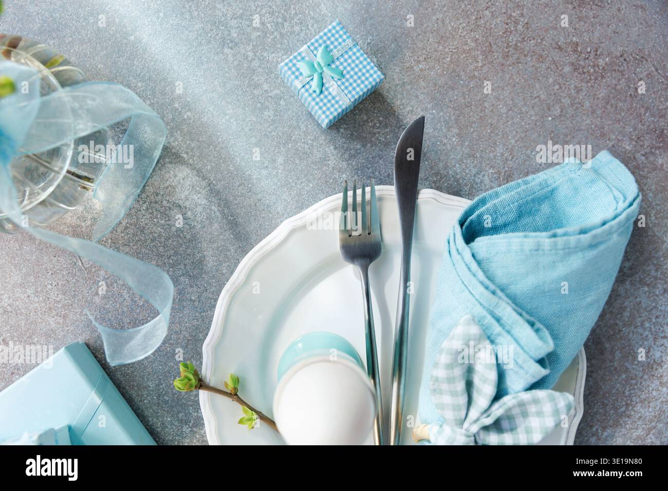 Holiday Table Setting with Budding Branch and Plate Stock Photo