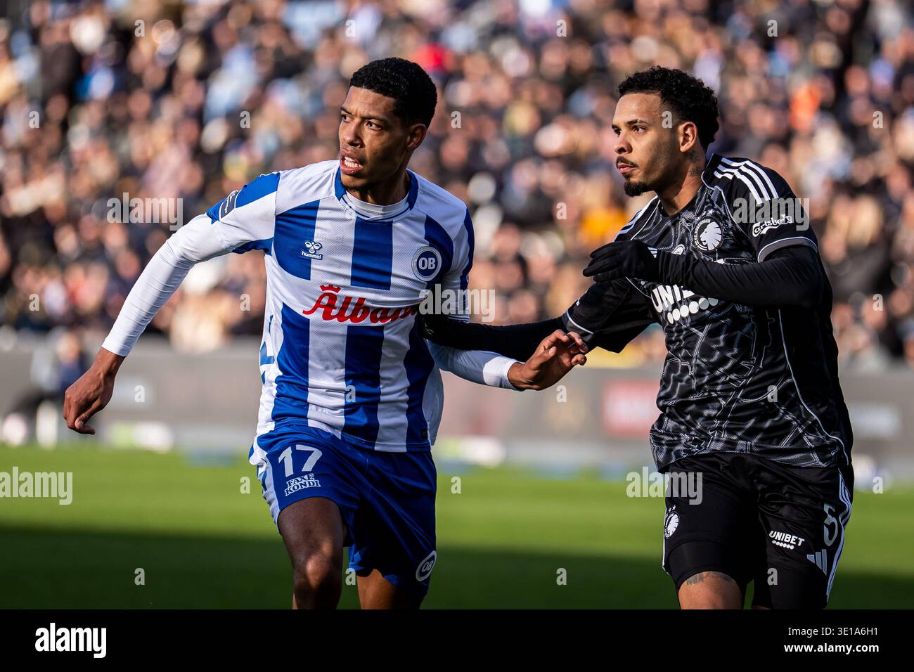Odense, Denmark. 15th Mar, 2026. Noah Ganaus (17) of Odense BK and Gabriel Pereira (5) of FC Copenhagen seen during the 3F Superliga match between Odense BK and FC Copenhagen at Nature Odense, Denmark. 15th Mar, 2026. Noah Ganaus (17) of Odense BK and Gabriel Pereira (5) of FC Copenhagen seen during the 3F Superliga match between Odense BK and FC Copenhagen at Nature