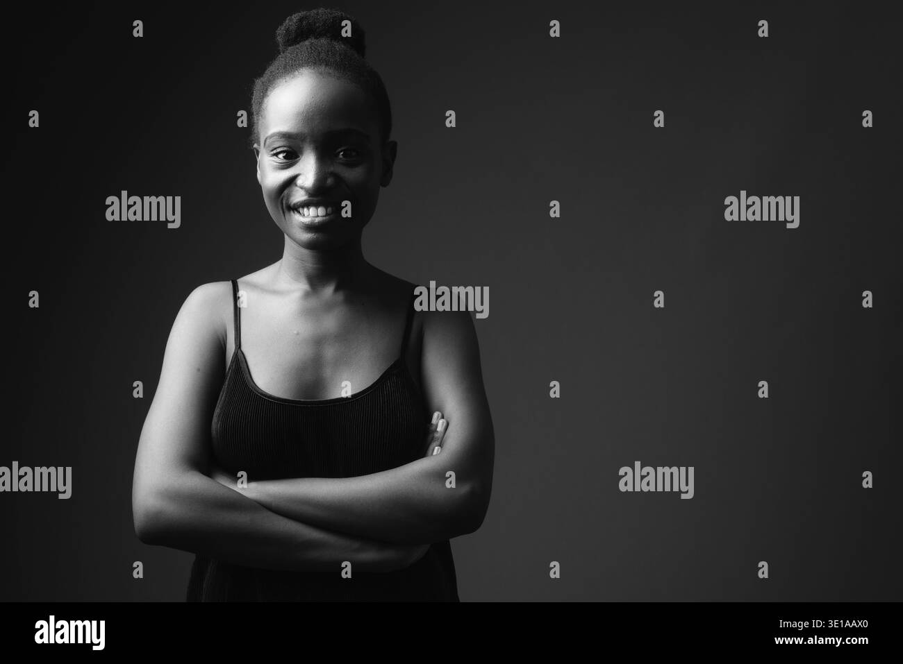 Studio shot of young beautiful African Zulu woman against black ...