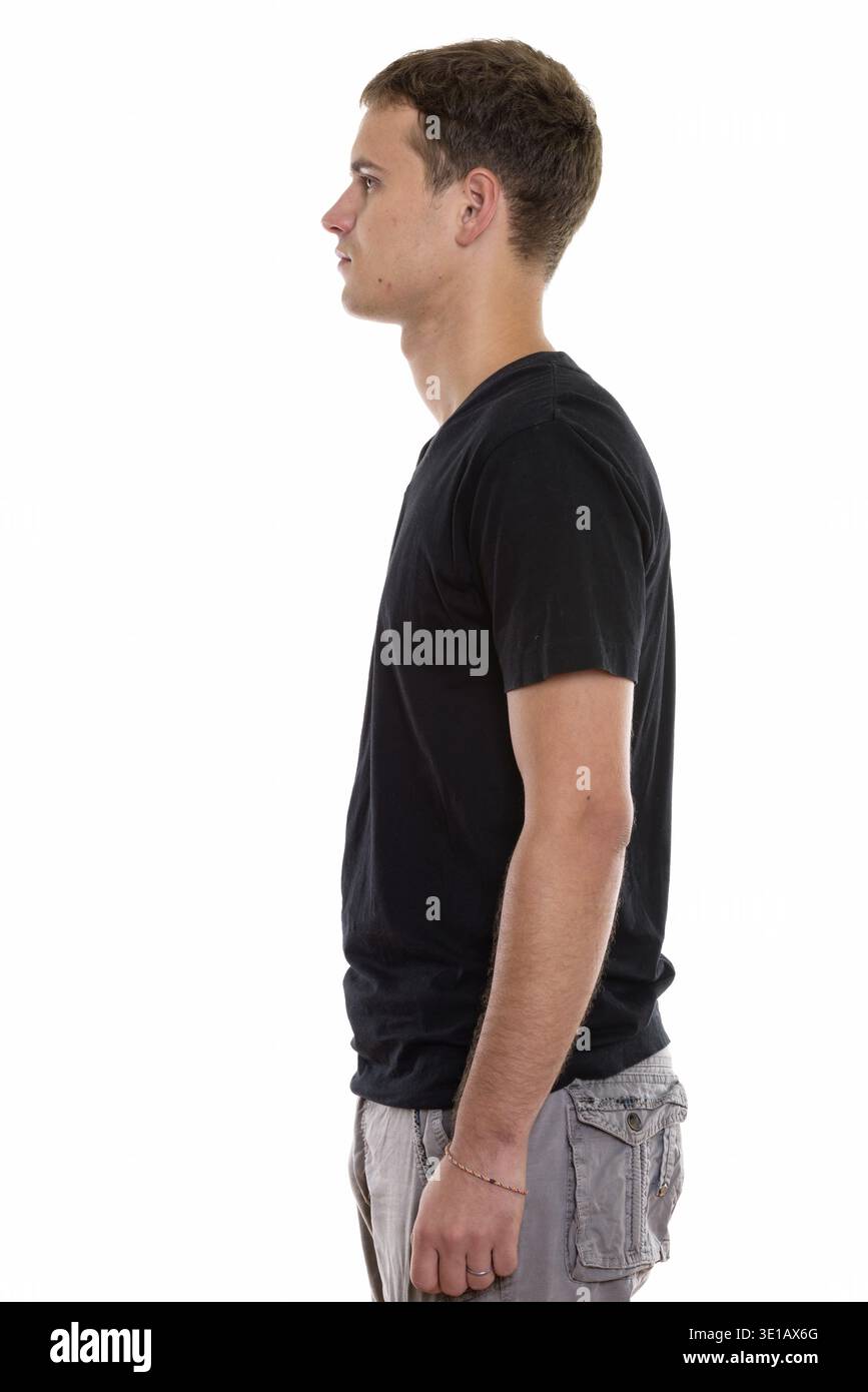 Profile view of young man standing Stock Photo