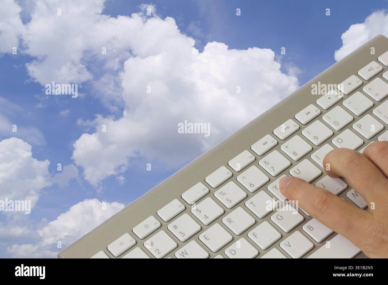 Cloud computing concept - keyboard over cloudscape Stock Photo