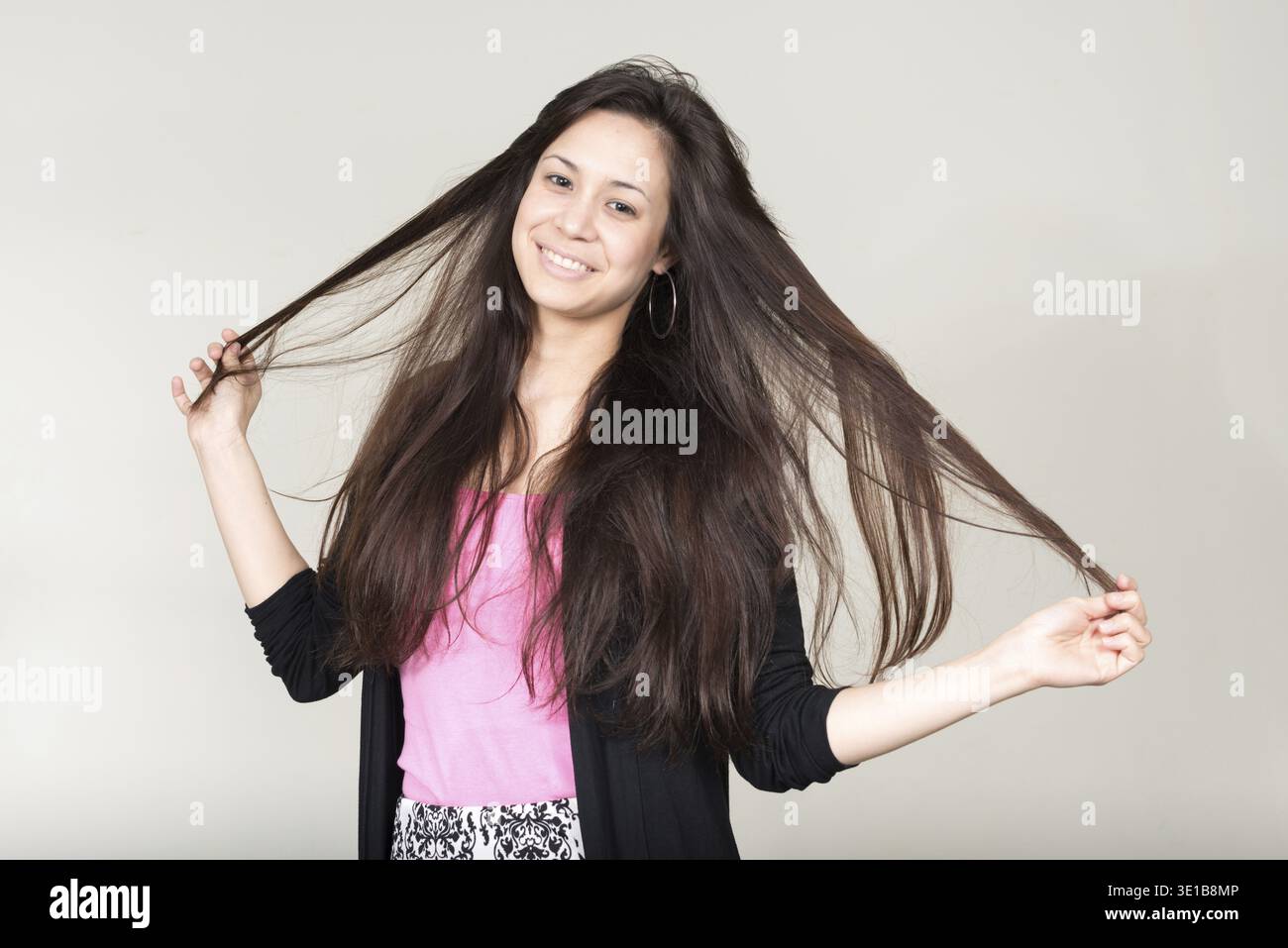 Studio shot of young beautiful multi ethnic woman against white background Stock Photo