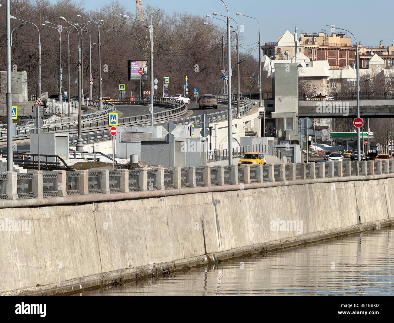 Moscow, Russia - March 15, 2026: road bridge, multilane traffic interchange above Yauza River near Andronyevskaya Embankment with cars moving along Stock Photo