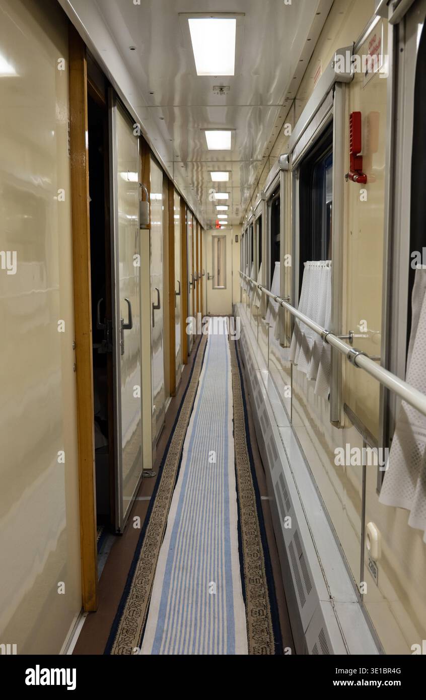 Rail Compartment Train interior corridor with windows and compartments, showcasing ...