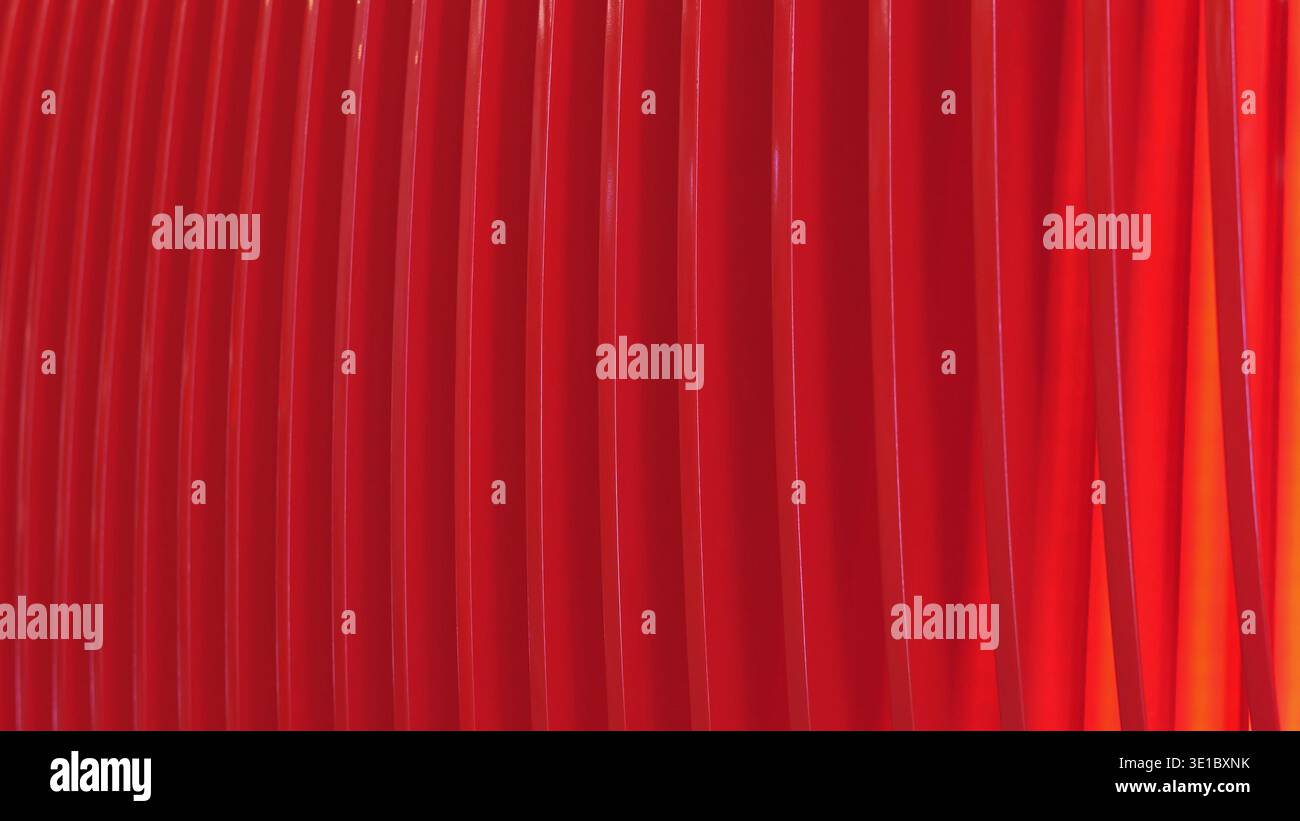 Red vertical elements creating an abstract pattern with a gradient light on the right Stock Photo