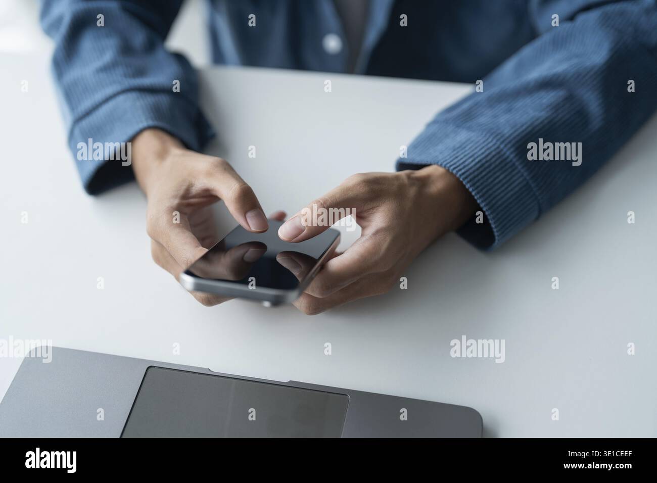 Man Using Smartphone in Modern Office Technology Stock Photo