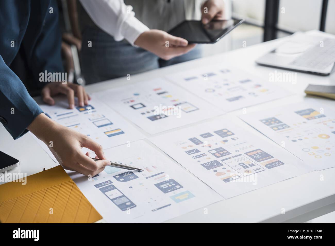 Developer team brainstorming user interface and experience designs for mobile application ux ui graphic prototype Stock Photo