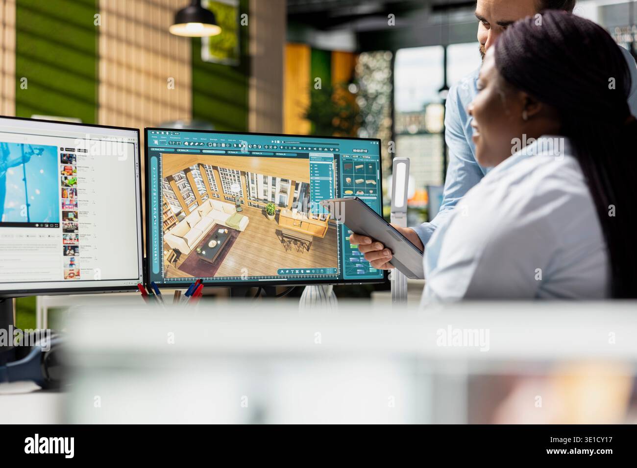 Team of designers developing digital 3D architecture model with CAD tools and software. Architect and worker uses interface to render apartment layout and prepare floor plan blueprints. Stock Photo