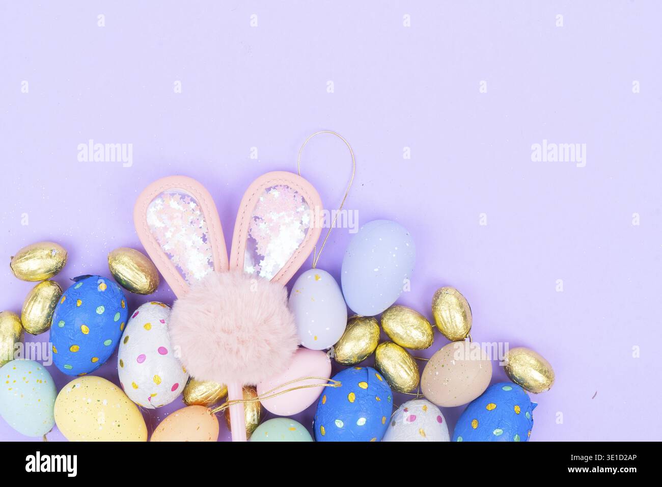 Easter scene with colored eggs and rabbit's ears Stock Photo