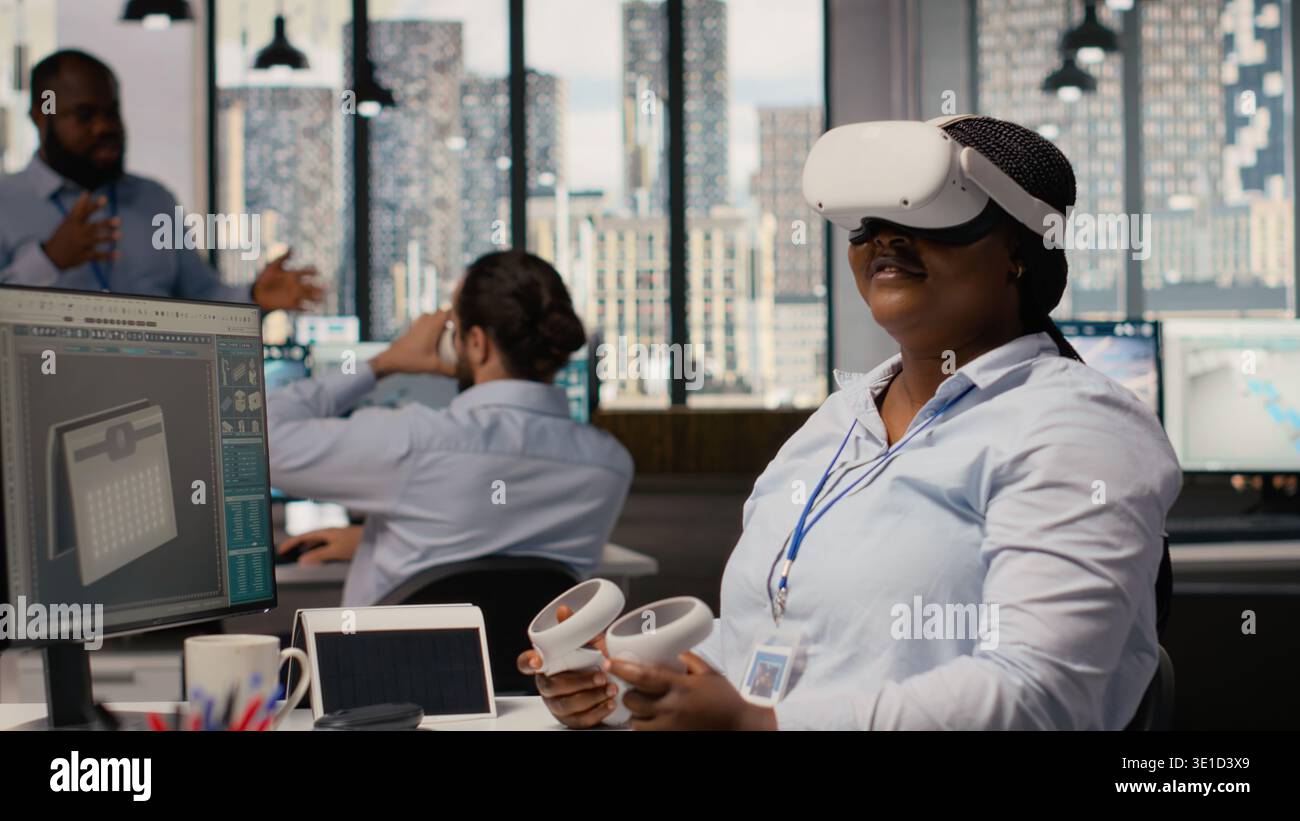 Engineer using virtual reality simulation to develop innovative solar powered device prototype. RD office professional uses VR headset to examining portable solar panel gadget, camera B Stock Photo