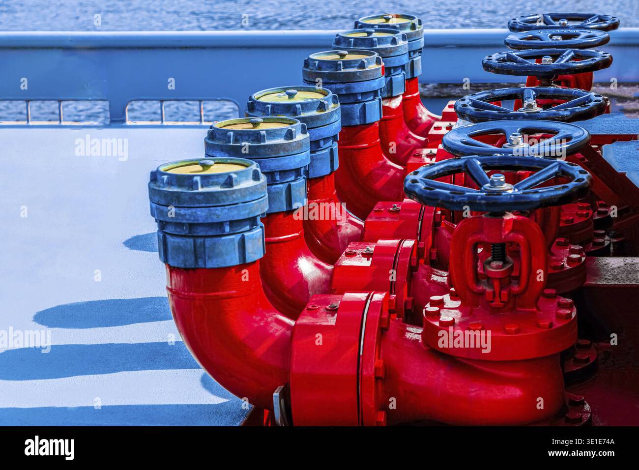 Bright background Five red fire hydrants on a fire line on a ship. fire ...