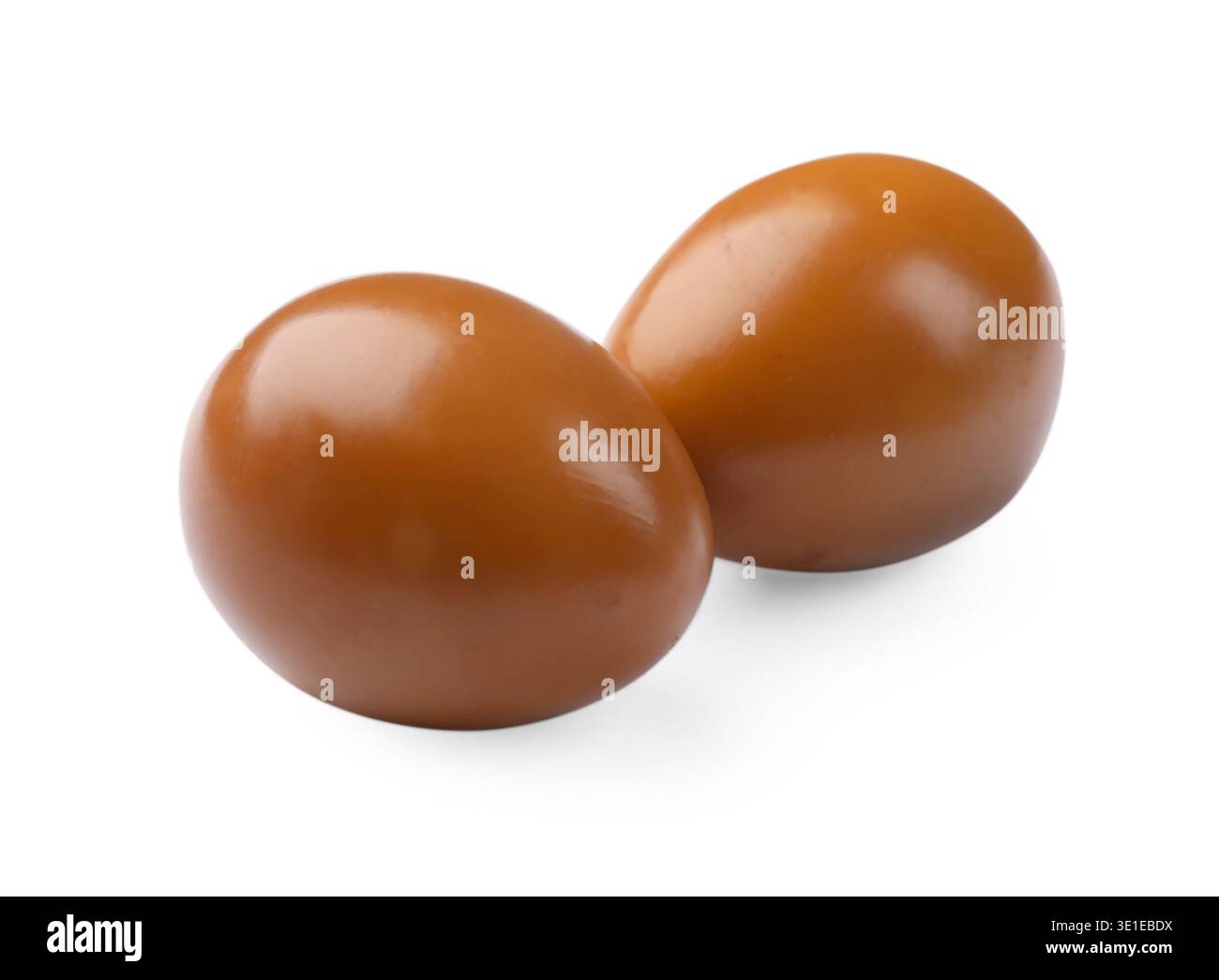 Two pickled quail eggs isolated on white Stock Photo