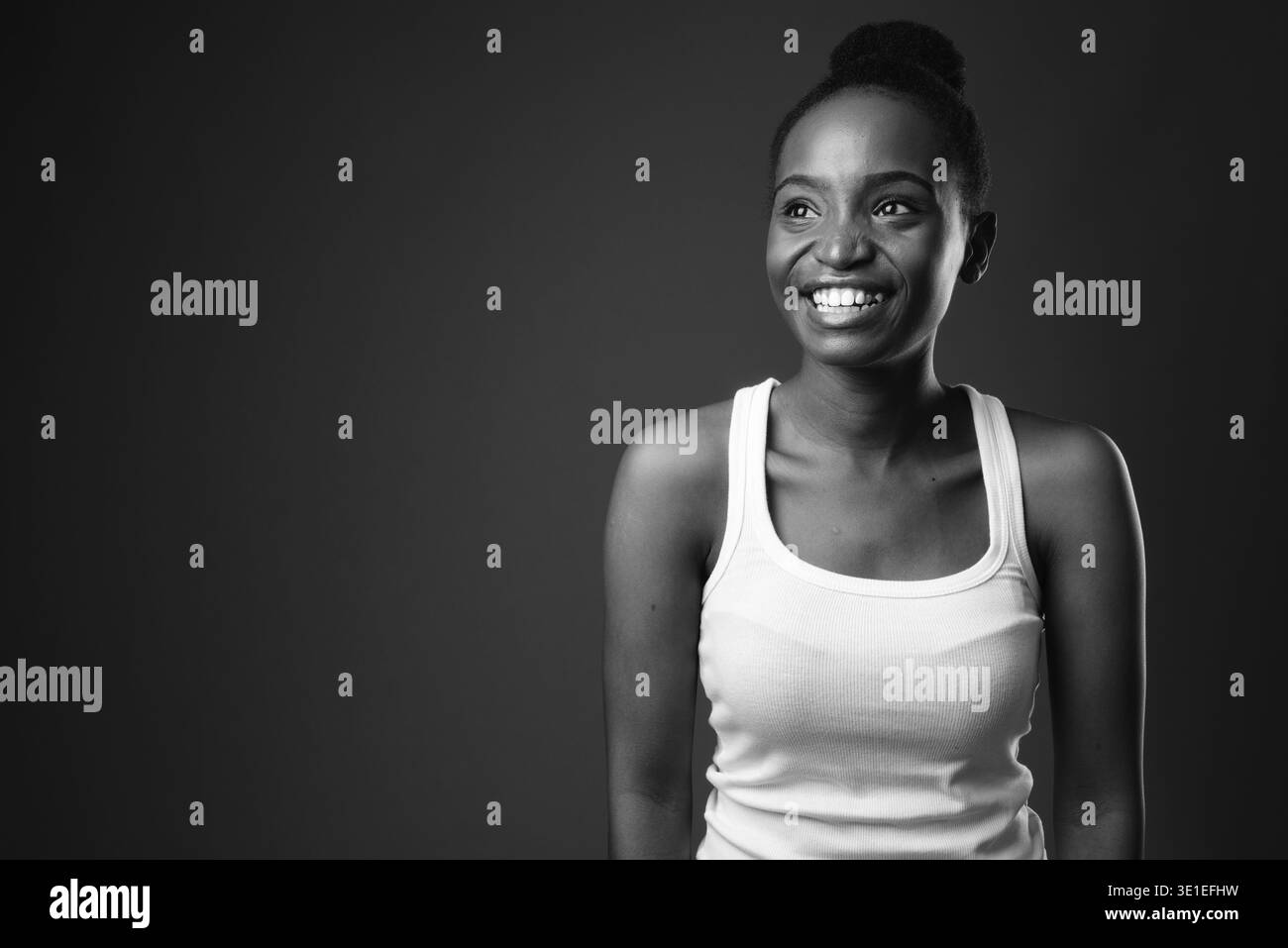 Studio shot of young beautiful African Zulu woman against black ...