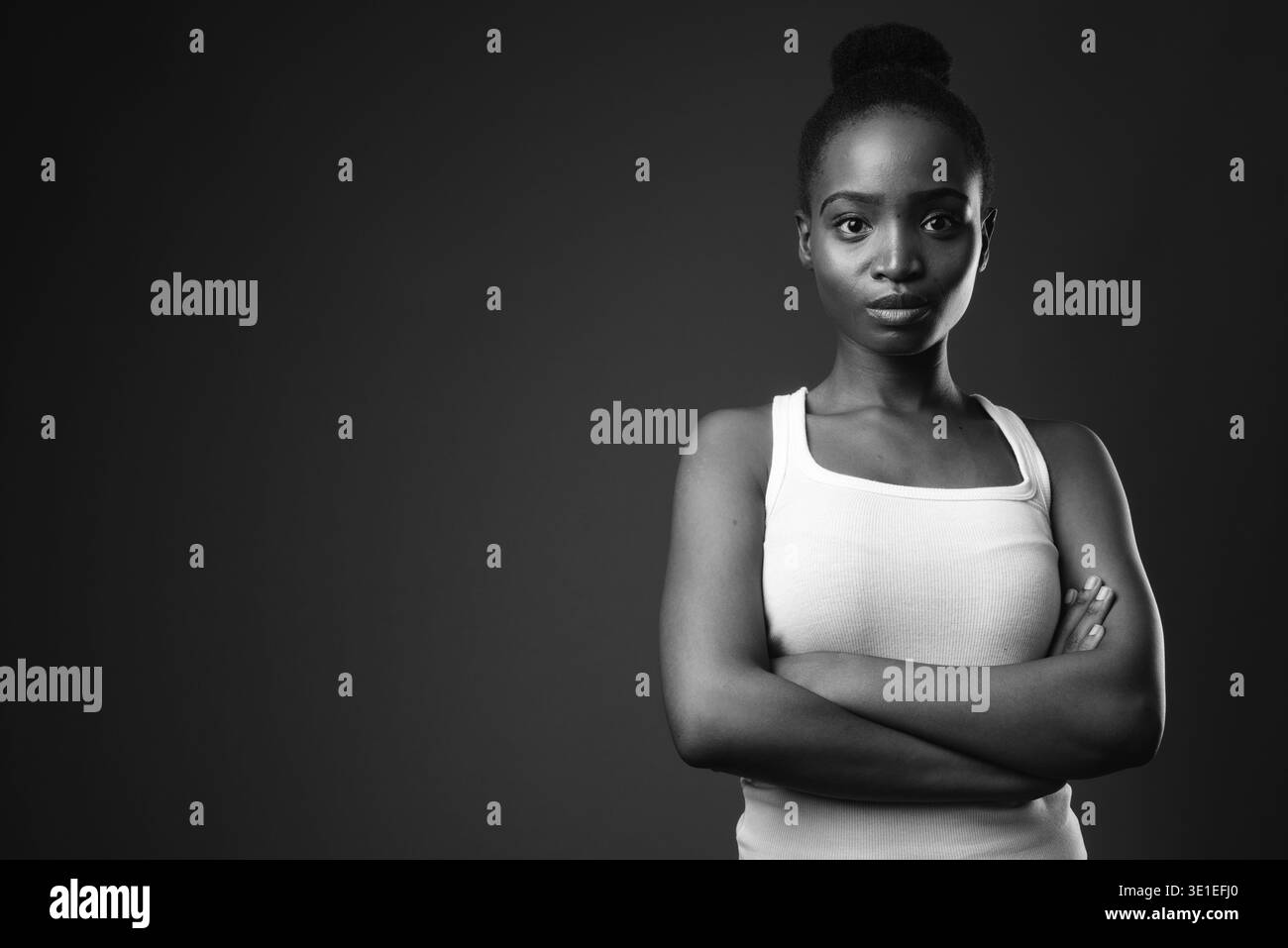 Studio shot of young beautiful African Zulu woman against black ...