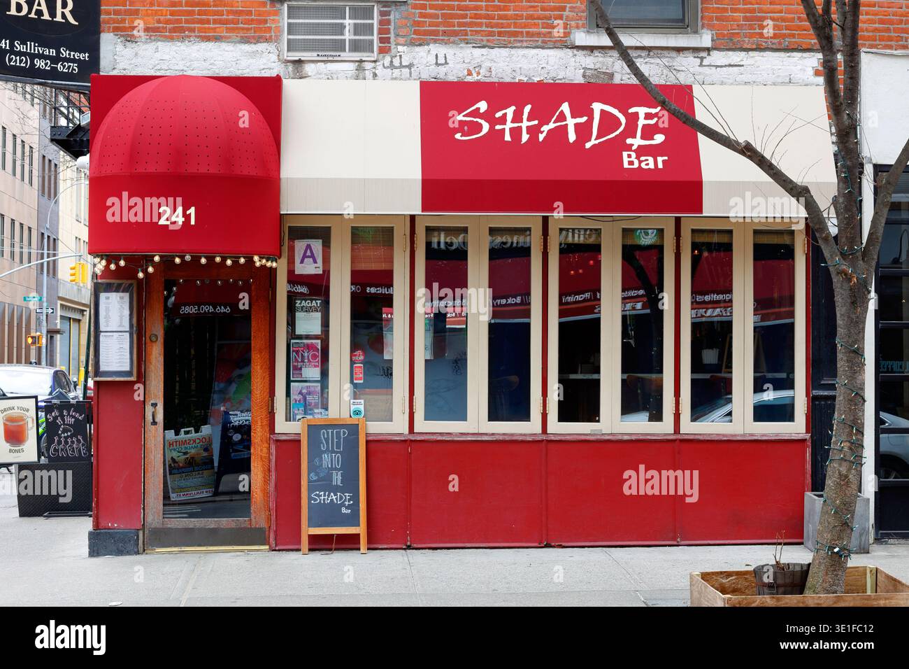 Shade Bar, 241 Sullivan St, New York, NYC storefront of a bar and restaurant in Manhattan's Greenwich Village. Stock Photo