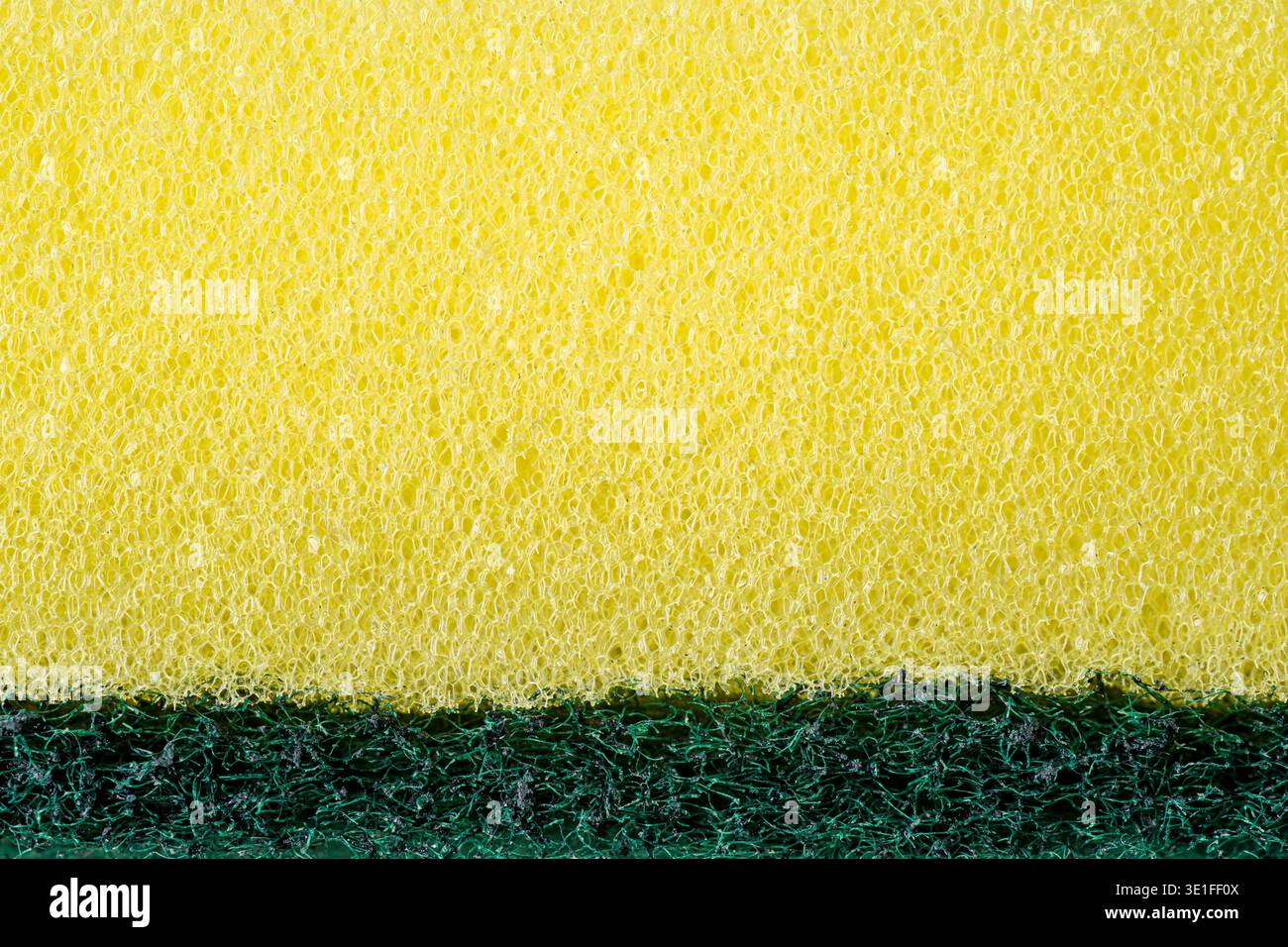 Yellow kitchen sponge macro texture with porous cleaning surface pattern Stock Photo