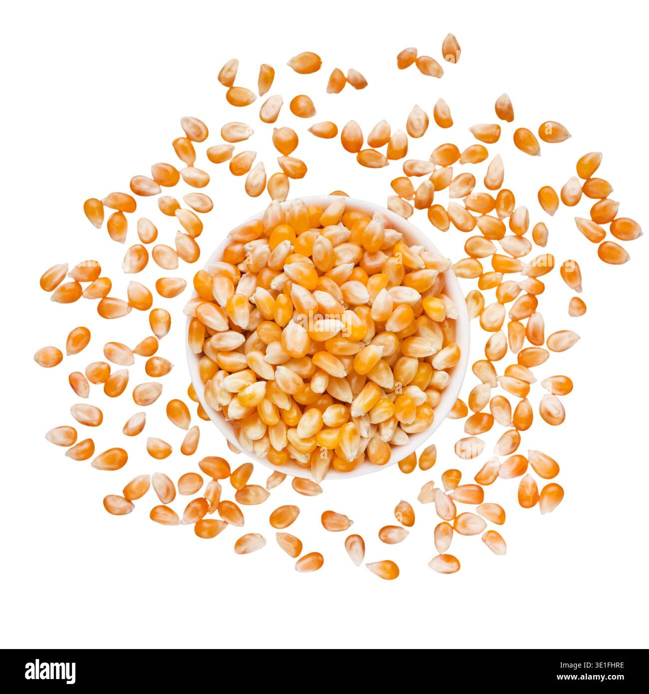 Dry corn seeds in bowl on white background Stock Photo
