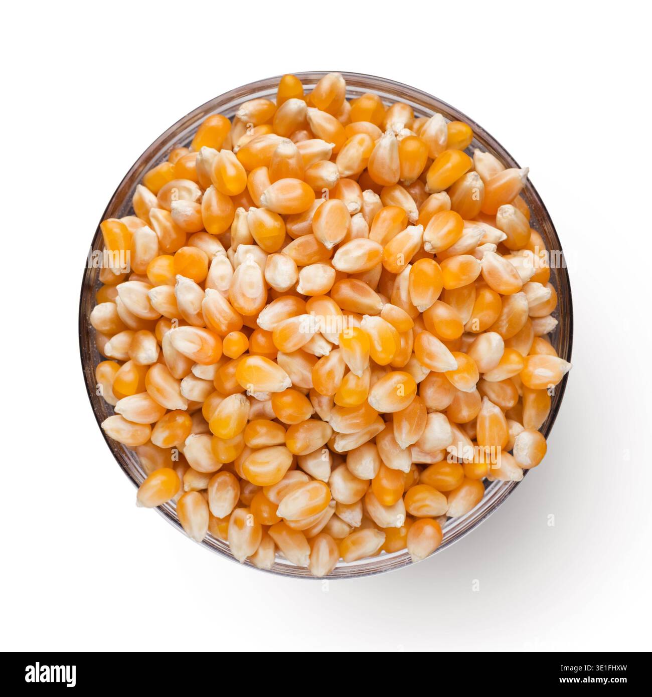 Dry corn in bowl on white background Stock Photo