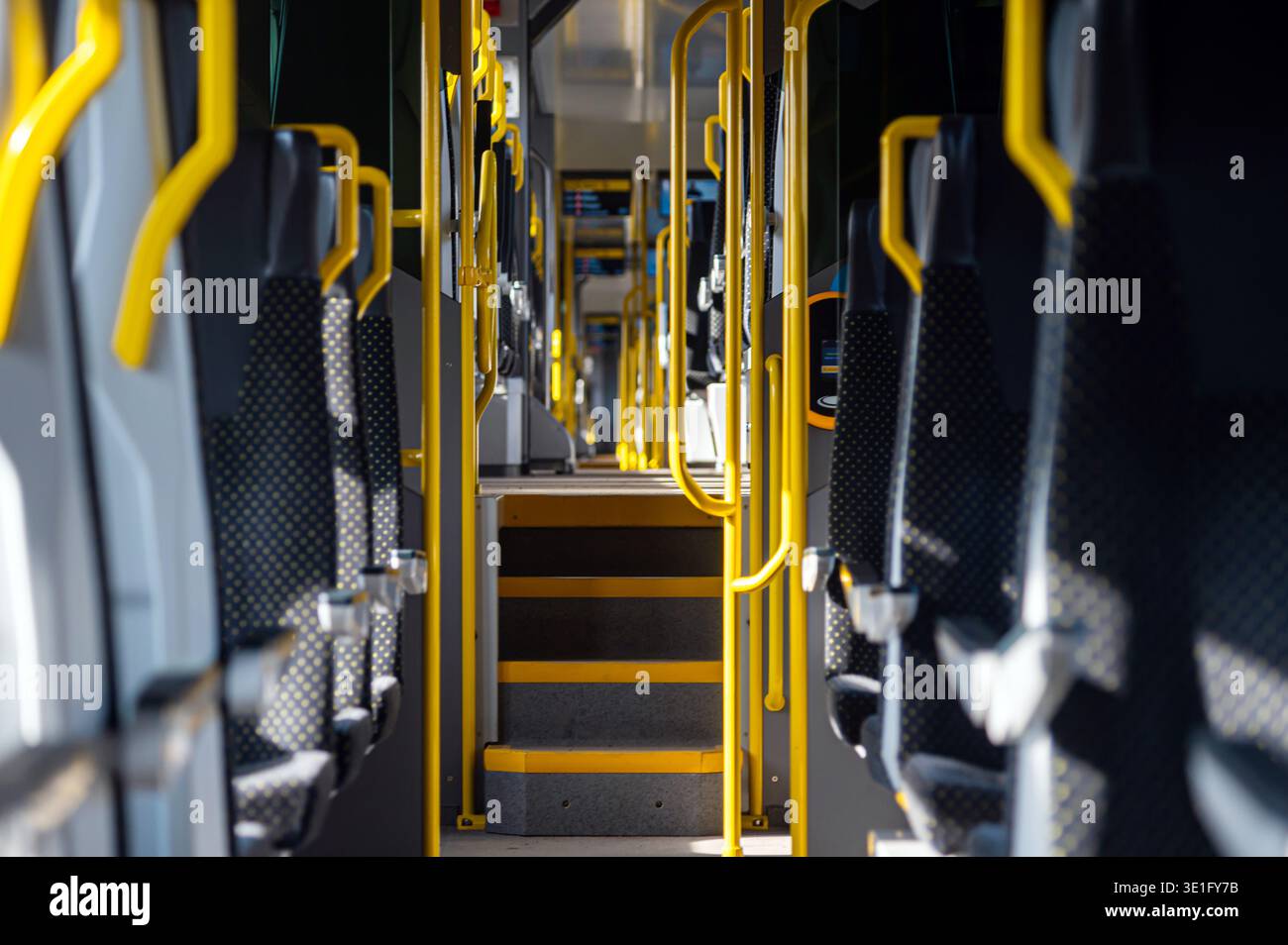 Bus aisle yellow handrails hi-res stock photography and images - Alamy