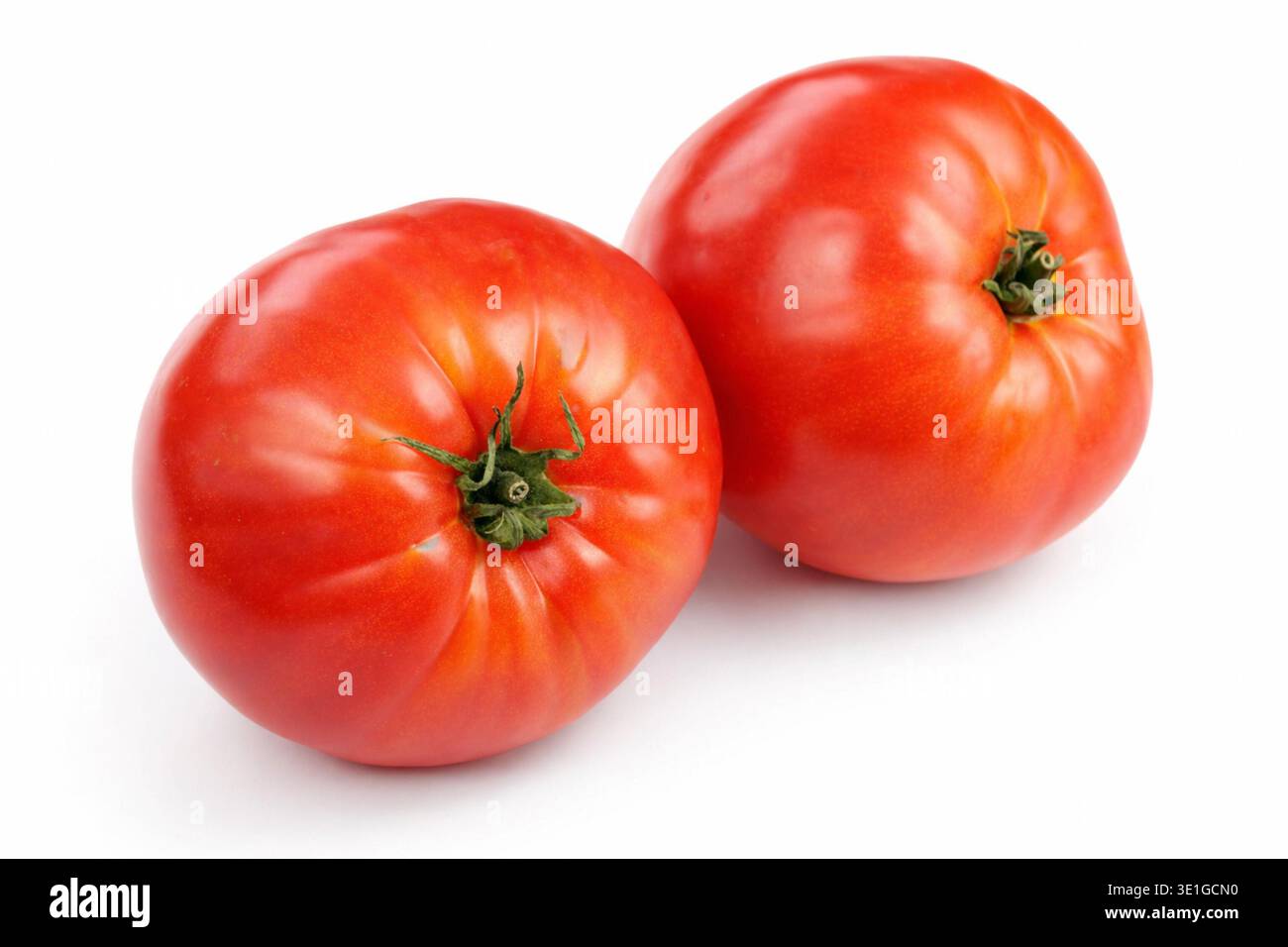 Fresh red tomatoes on a white background Stock Photo - Alamy