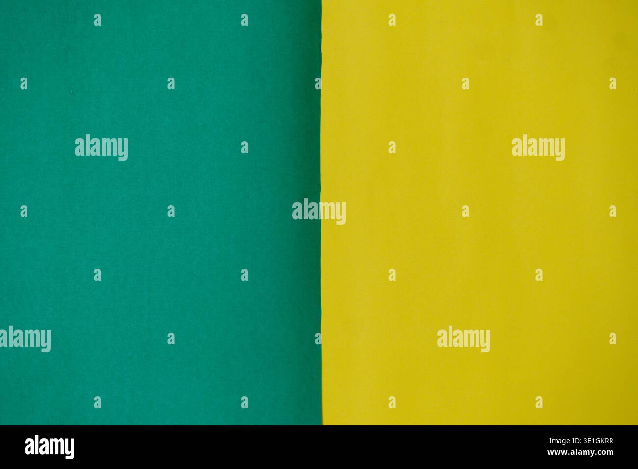 A vibrant abstract background featuring a clean vertical split between bright green and sunny yellow colors. Perfect for design, presentations, or as Stock Photo