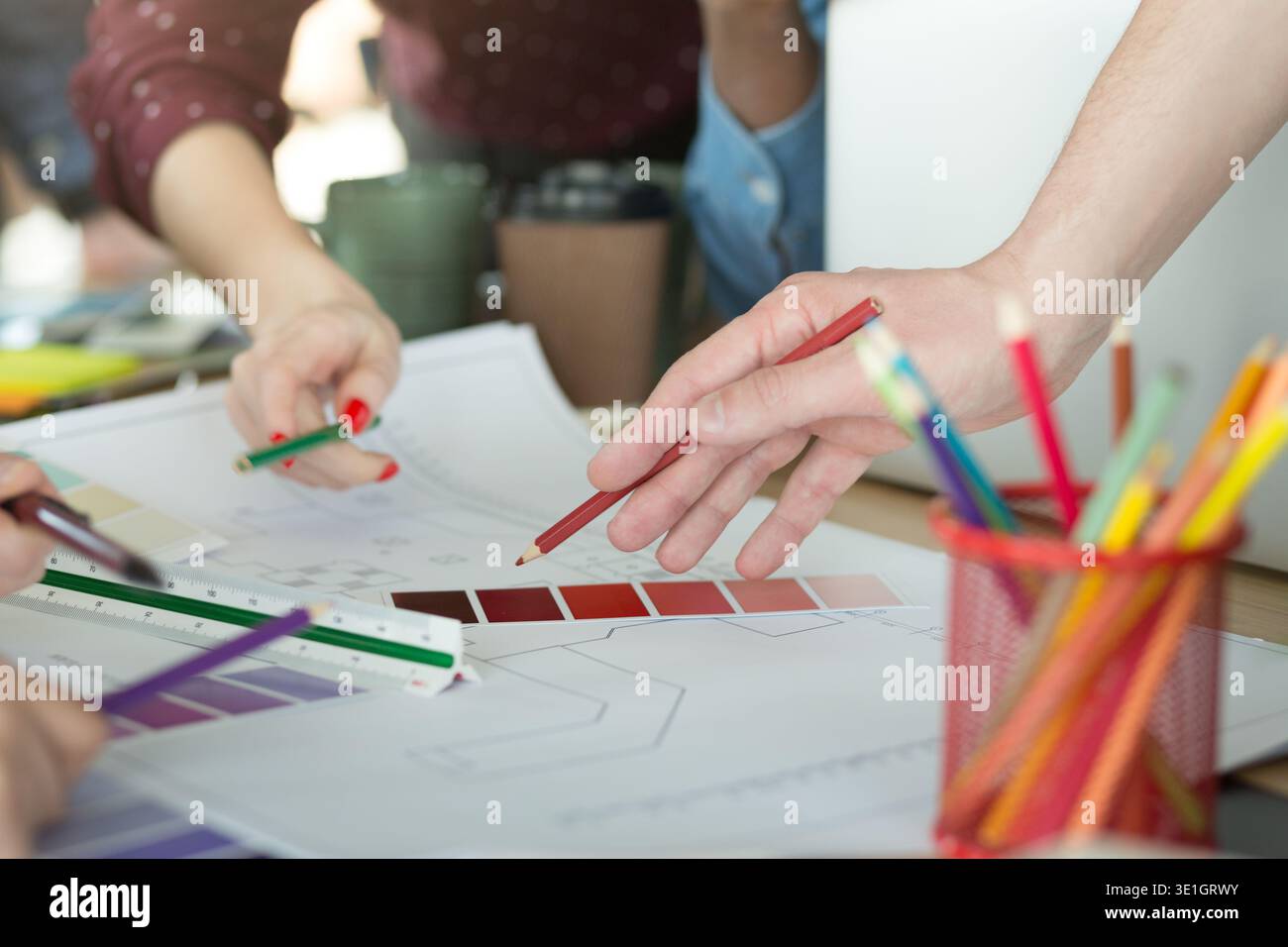 Creative designers working with color samples for selection Stock Photo