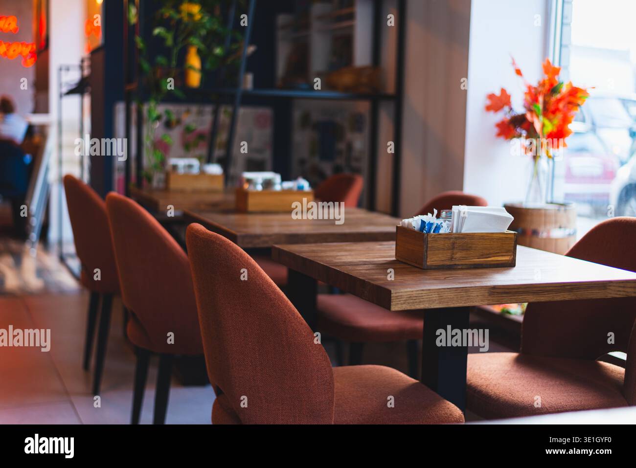 A cozy cafe restaurant in warm colors overlooking the window. warm orange and brown colors prevail. High quality photo Stock Photo