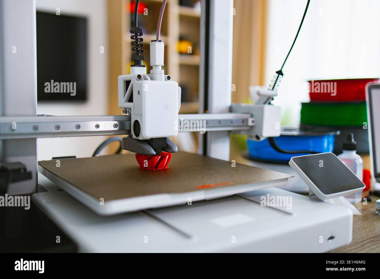 3D Printer Creating Red Object Stock Photo