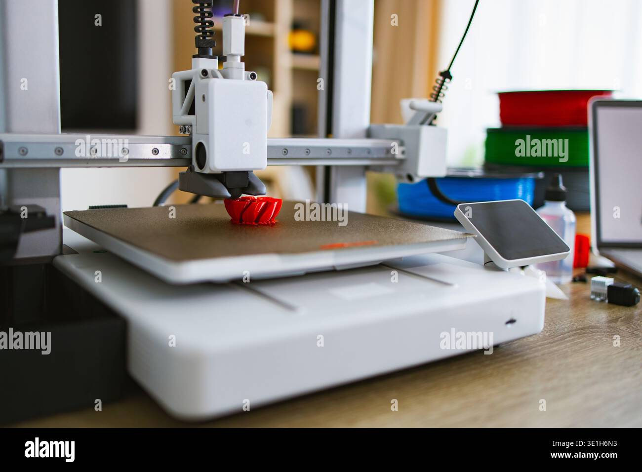 3D Printer Creating Red Object Stock Photo