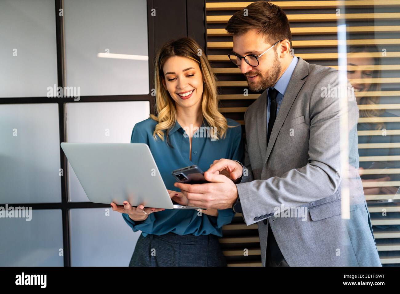 Mixed team of software engineers brainstorming ideas. Diverse app developers collaborating as group Stock Photo