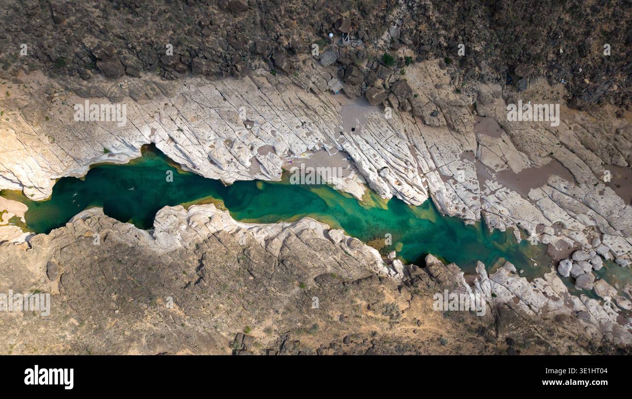 Natural Formations Rivers Aerial top view of a narrow turquoise river cutting through pale rock ...