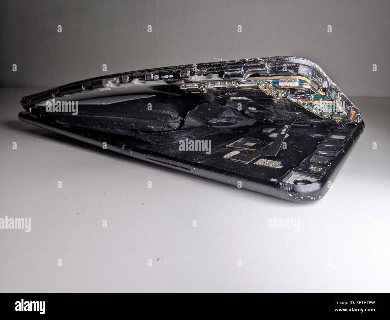 Crushed Smartphone Photographed For Insurance Claim, Exposed Internals ...