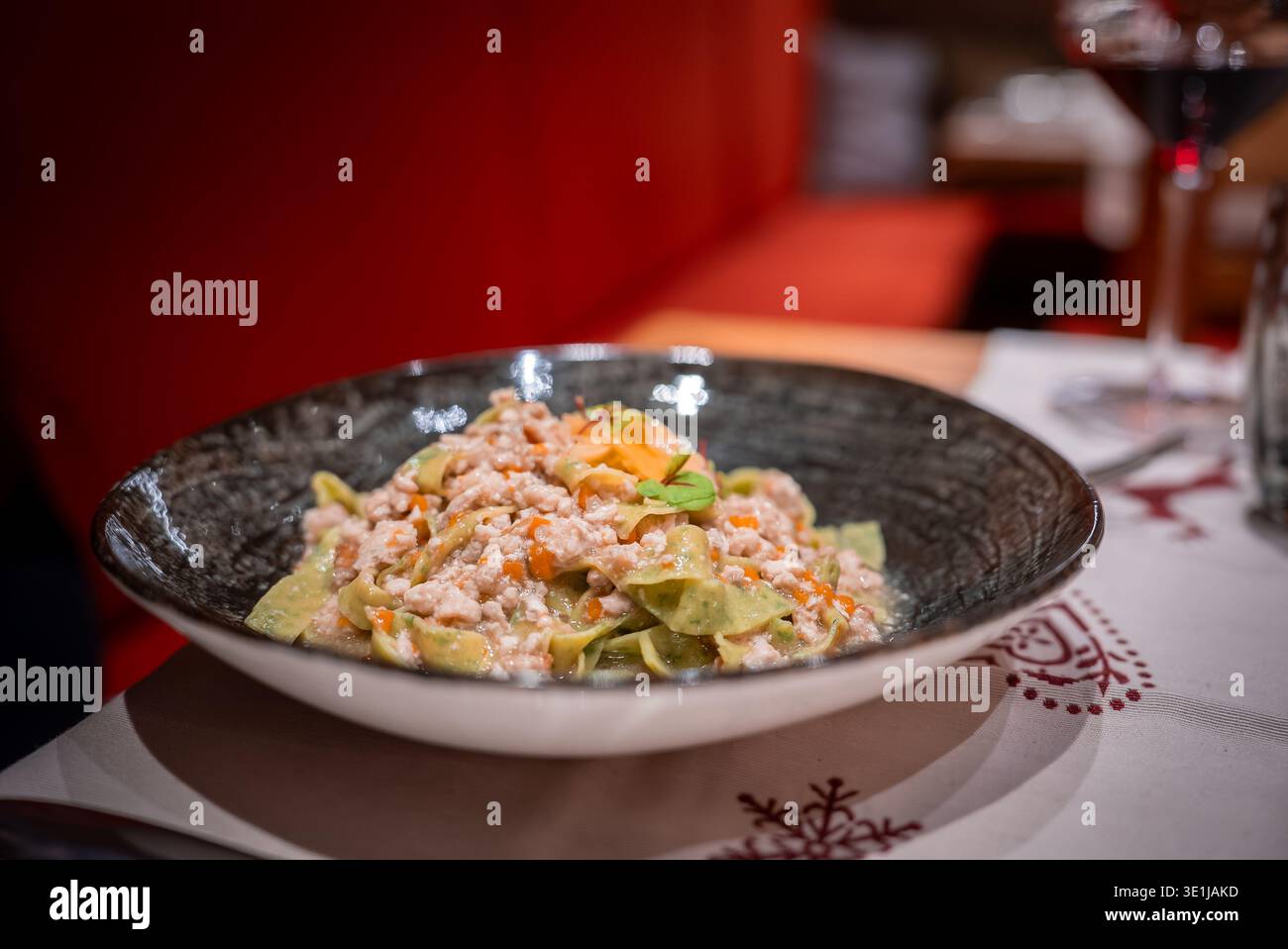 Gourmet tagliatelle with creamy ragu in San Domenico, Italian Alps Stock Photo