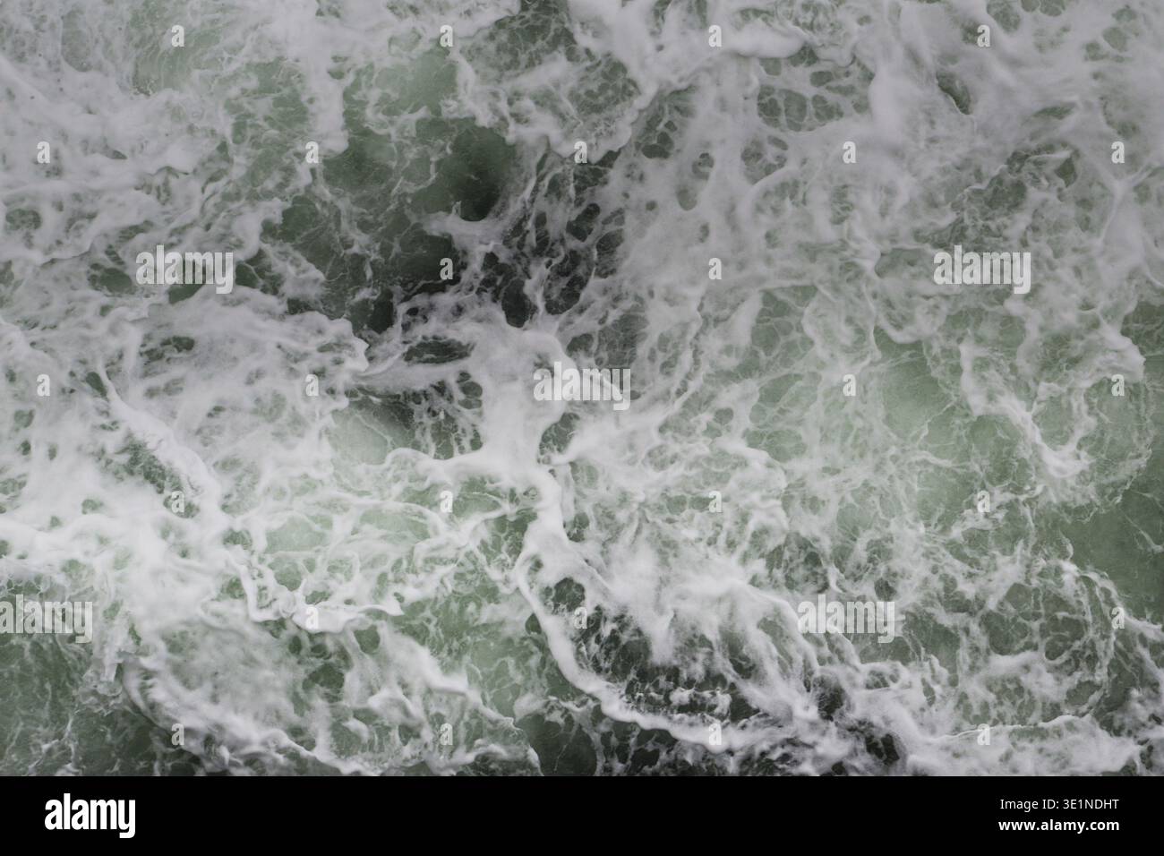 Big water splash seen from above a boat Stock Photo
