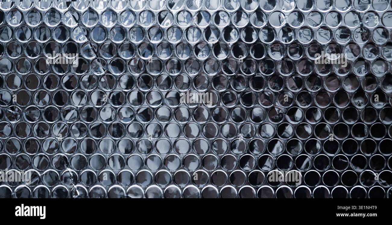 Silver reflective bubble wrap texture with circular pattern Stock Photo