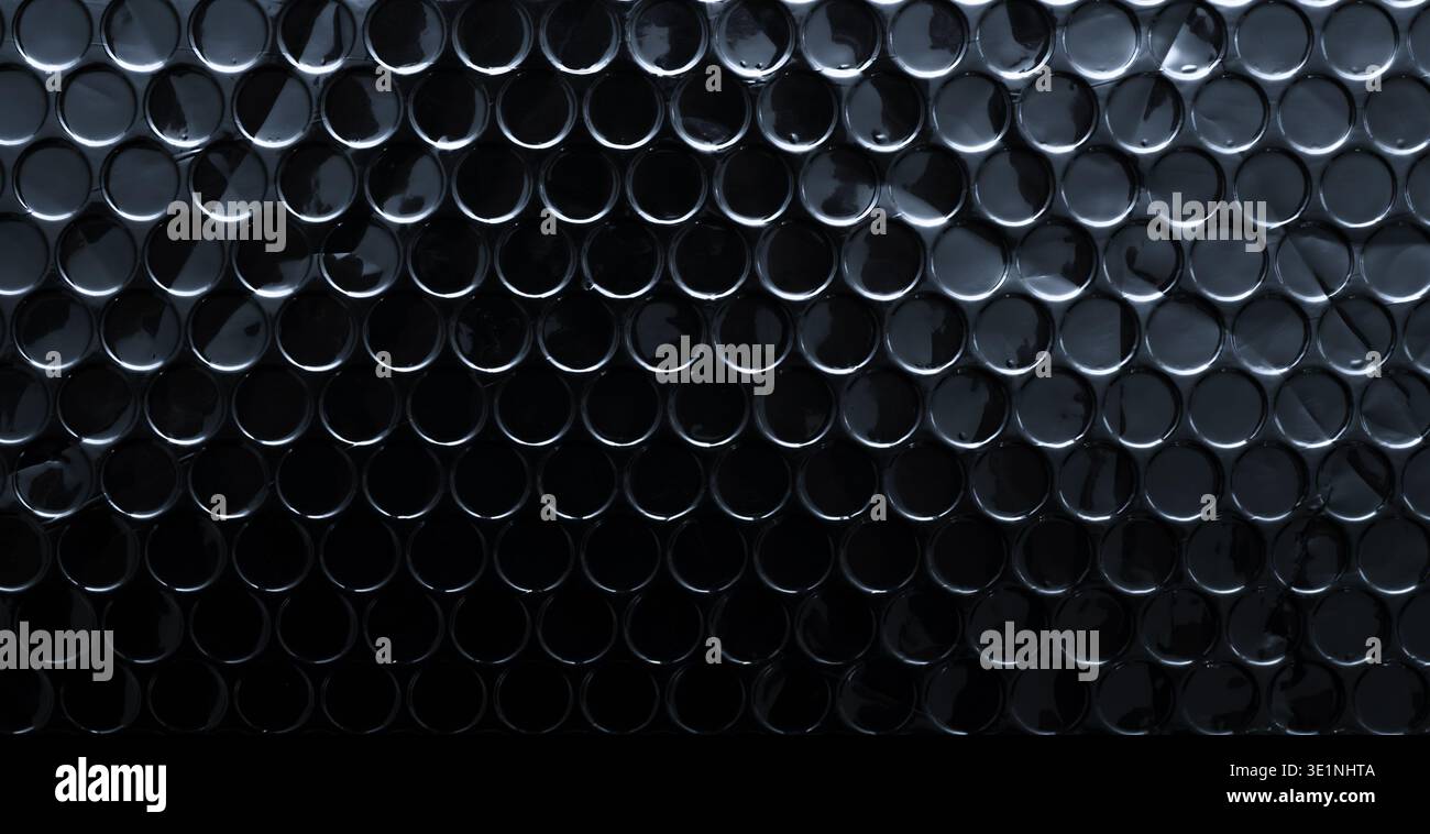 Dark black metallic bubble wrap texture background Stock Photo