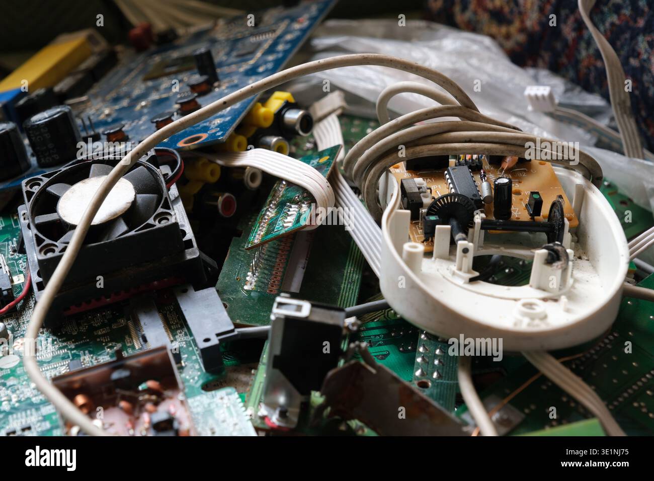Comsumer electronics waste. Discarded technological or electronic devices. E-waste and recycling concept. Stock Photo