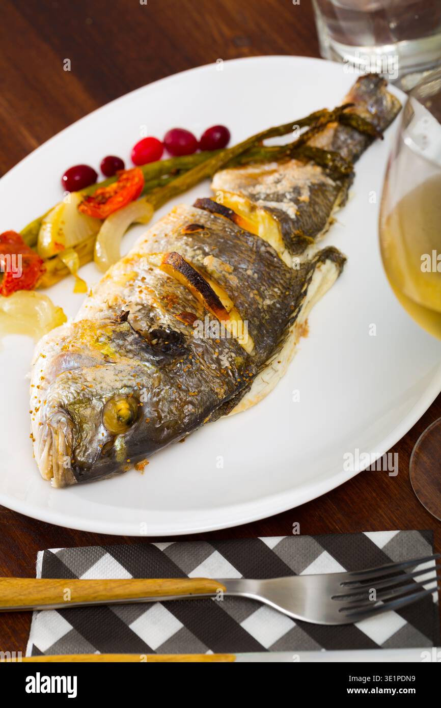 Grilled dorada with baked vegetables Stock Photo