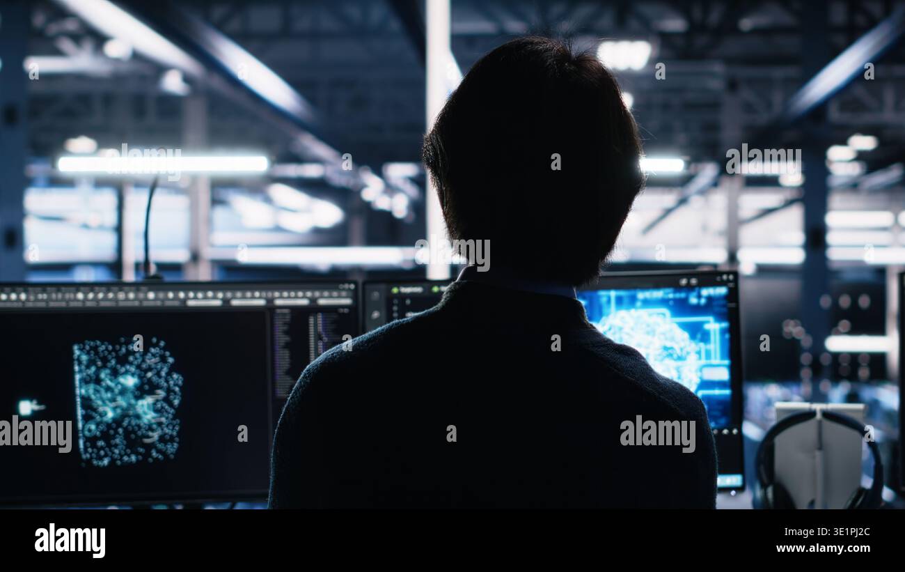 Admin in server room drinks coffee while using AI to review infrastructure diagnostics. IT specialist enjoys beverage in data center while analyzing performance with artificial intelligence, camera A Stock Photo