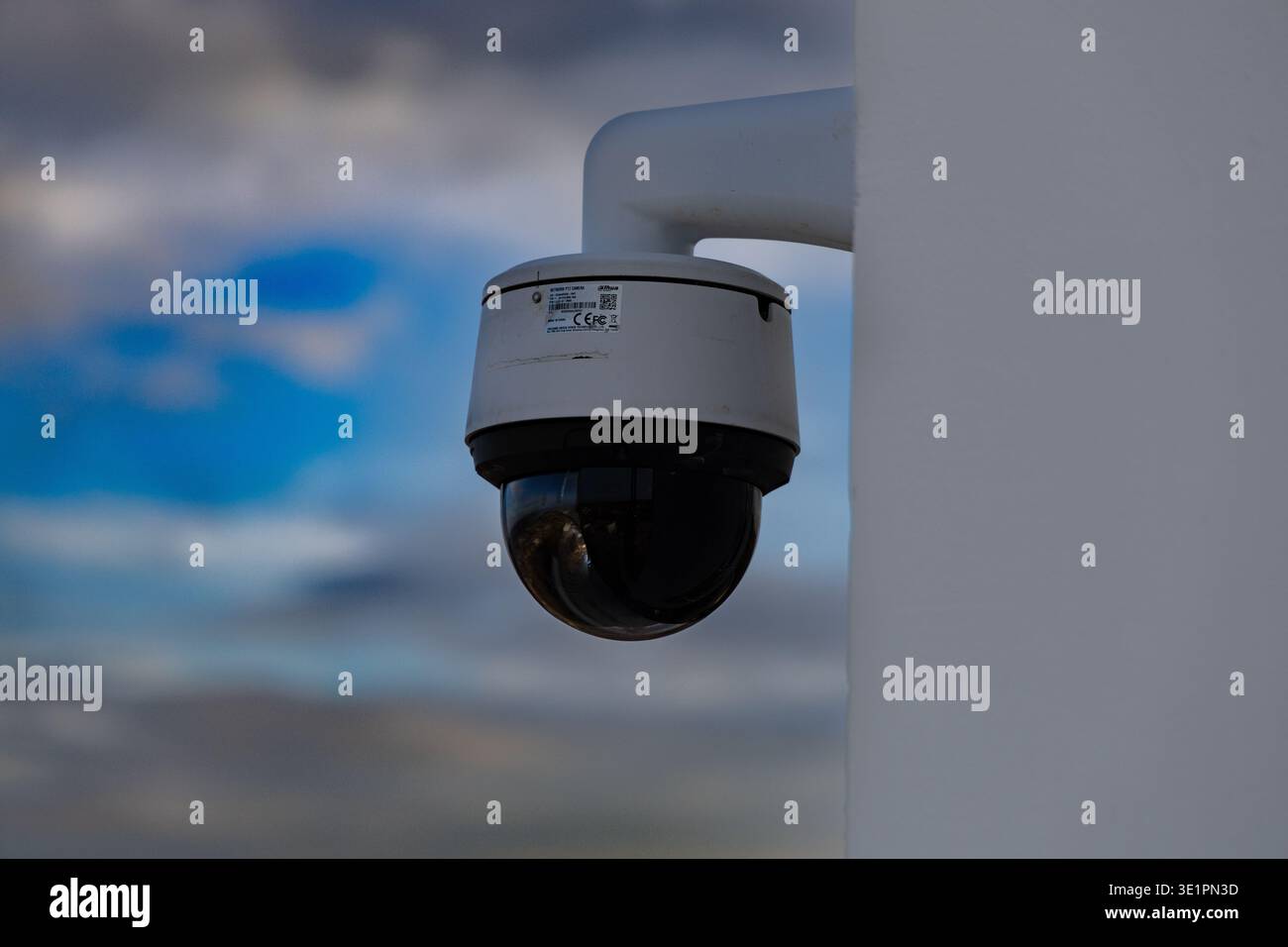Outdoor Security Surveillance Camera Mounted Against Sky Stock Photo