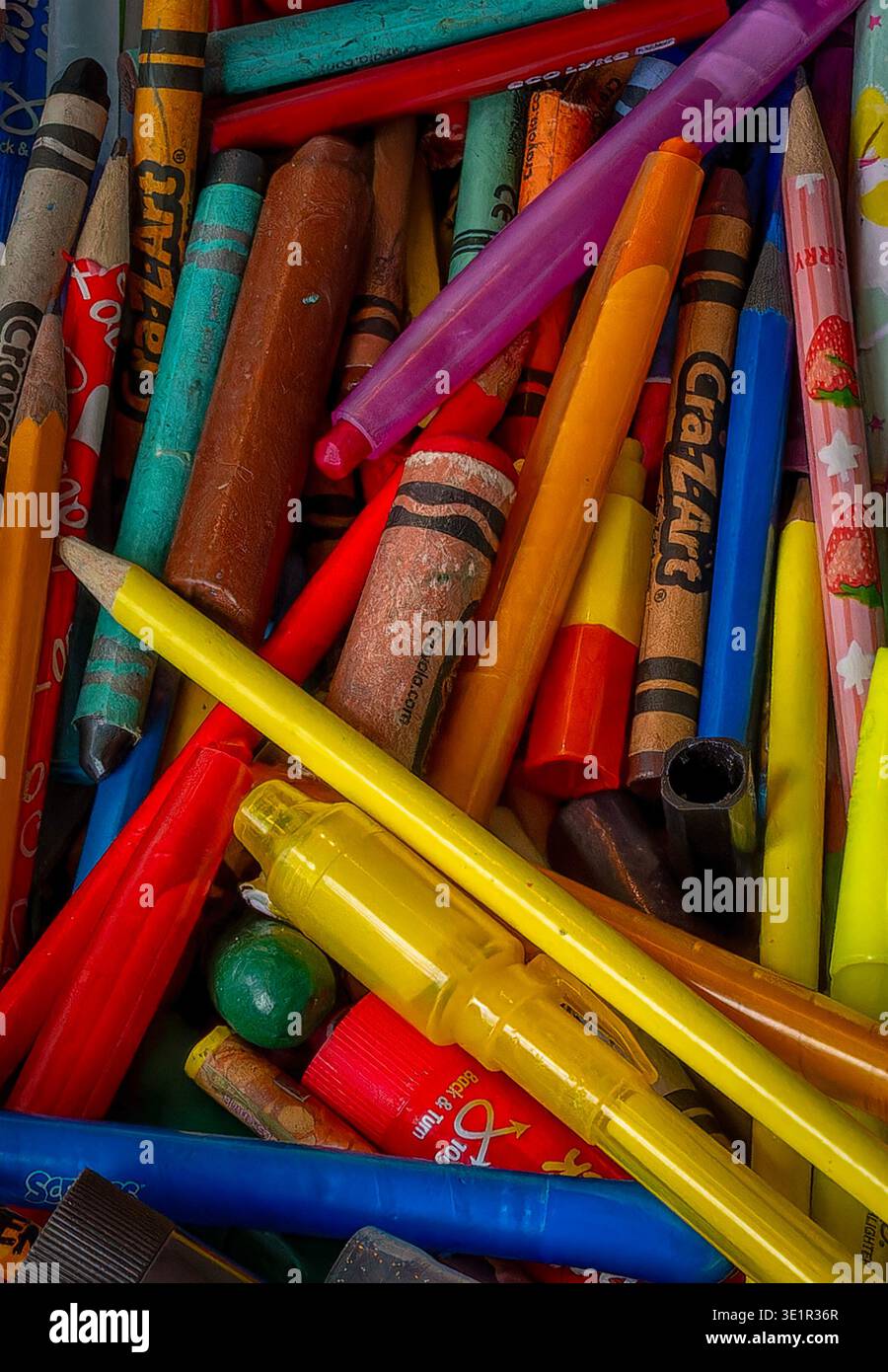 Looking down at a chaotic pile of coloring instraments Stock Photo
