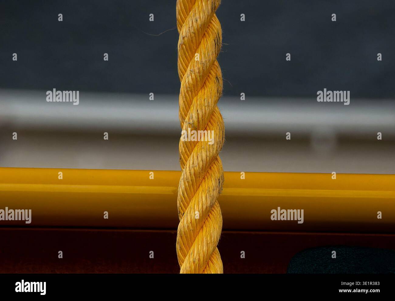 Yellow Polypropylene rope hanging down Stock Photo