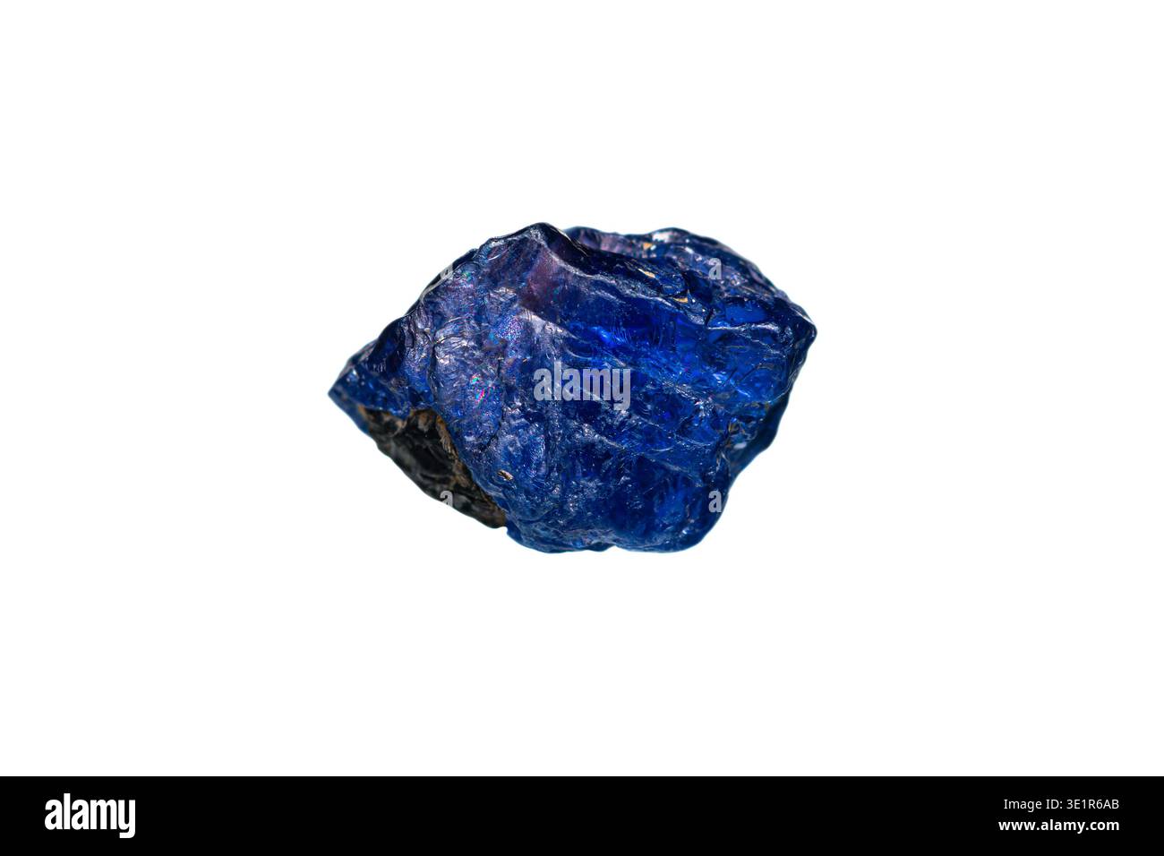 Closeup natural rough Burmese royal blue sapphire gemstone on white background (corundum group) Stock Photo