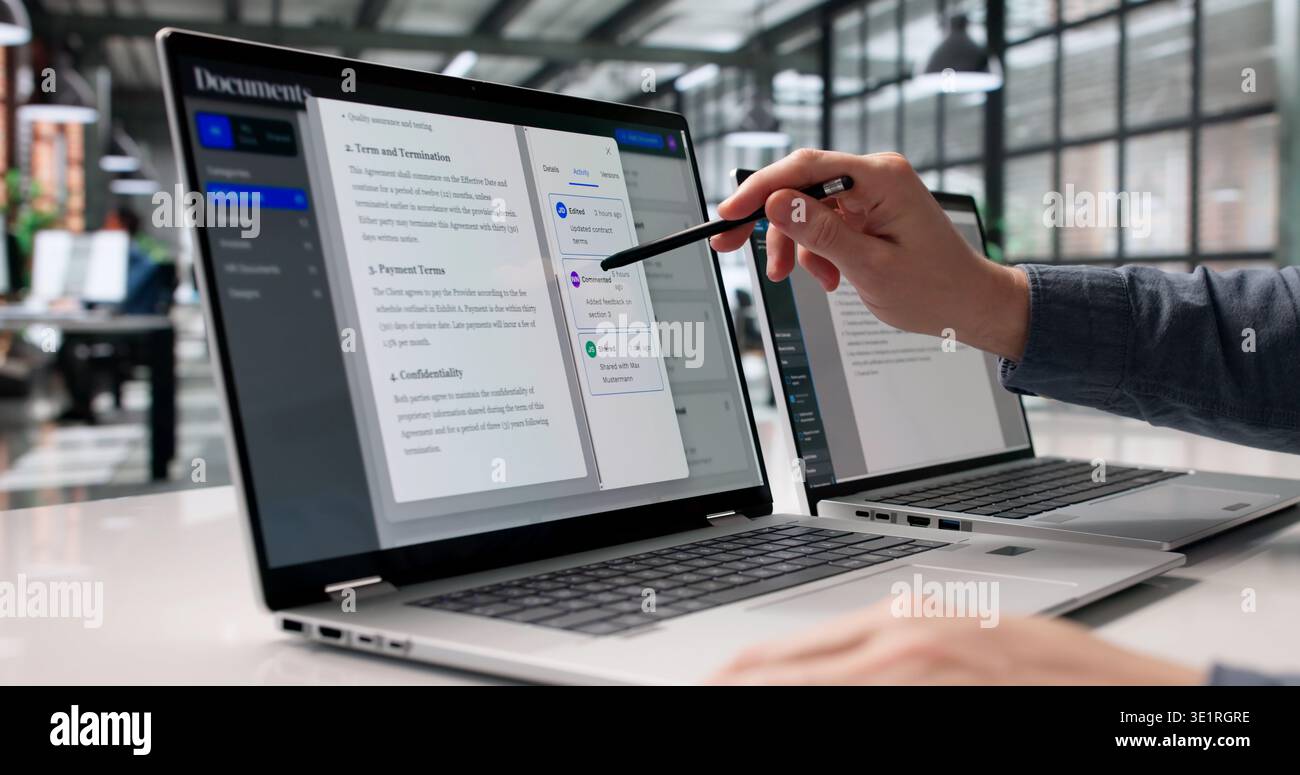 Diligent Professional Systematically Arranges Digital Documents On Laptop For Efficient Retrieval Stock Photo