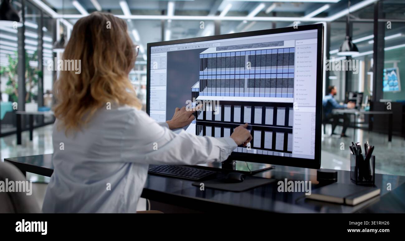 Female Architect Using 3D BIM Technology For Building Design Stock Photo