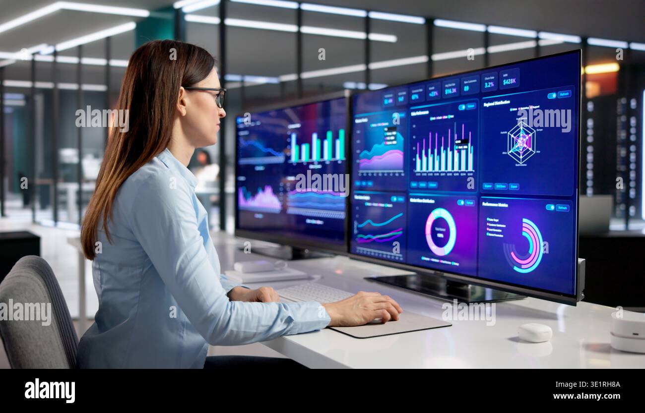 Financial Analyst Examining Interactive Dashboard In Contemporary Workspace Stock Photo