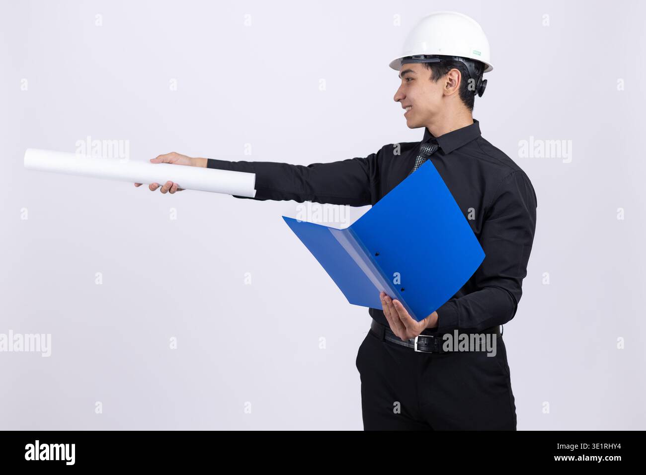 Engineer pointing with document folder to the side Stock Photo